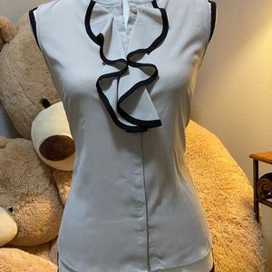 Sleeveless blouse with ruffles